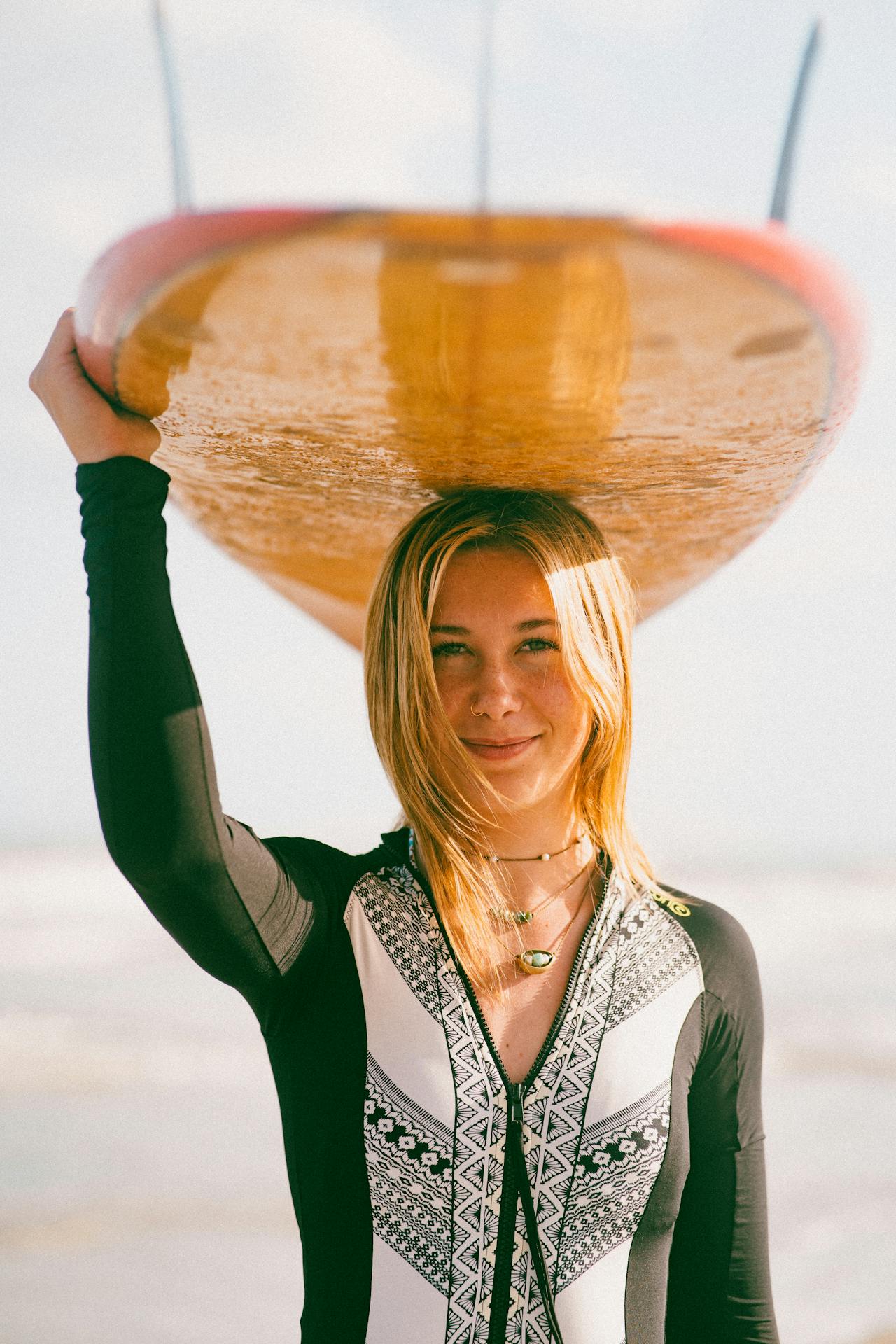 A lady with surfboard